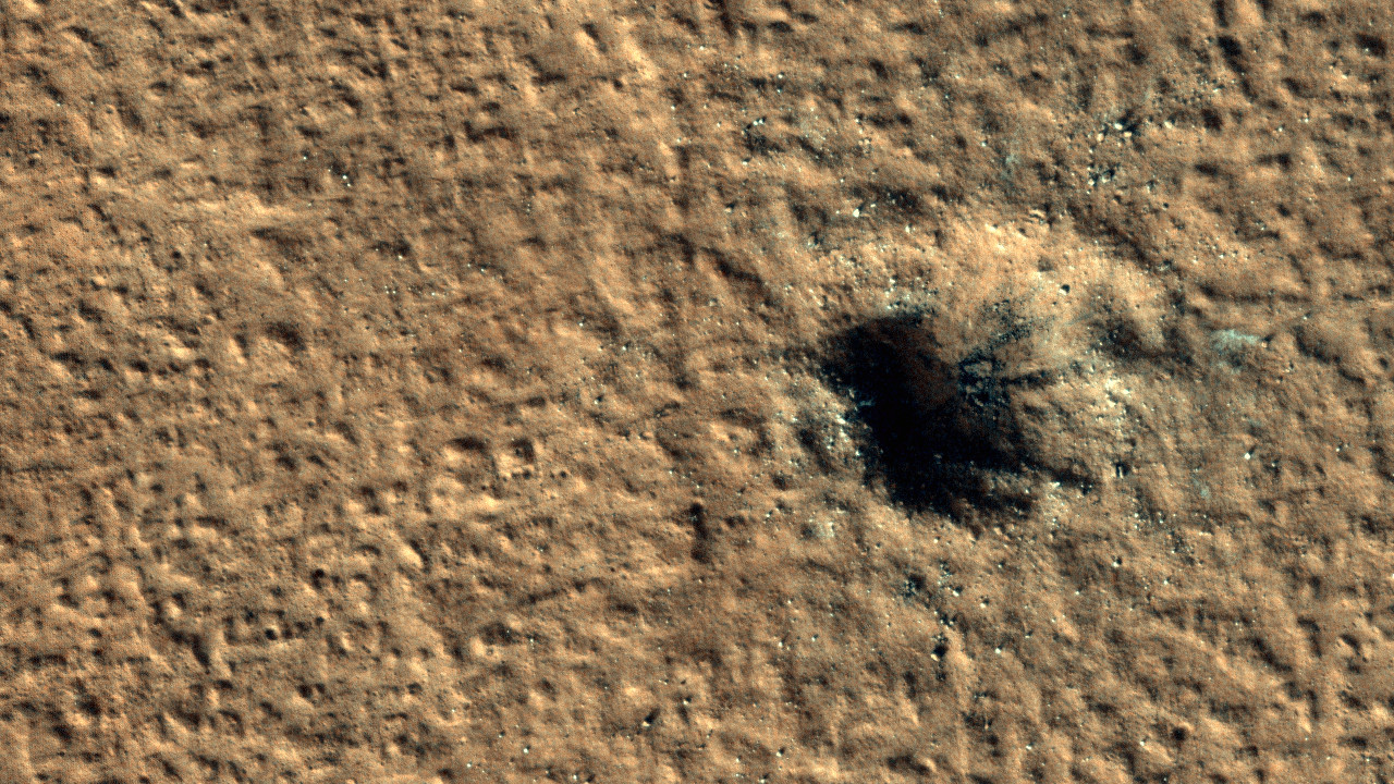 A new impact crater on Mars has discovered a 'hidden' cache of ice