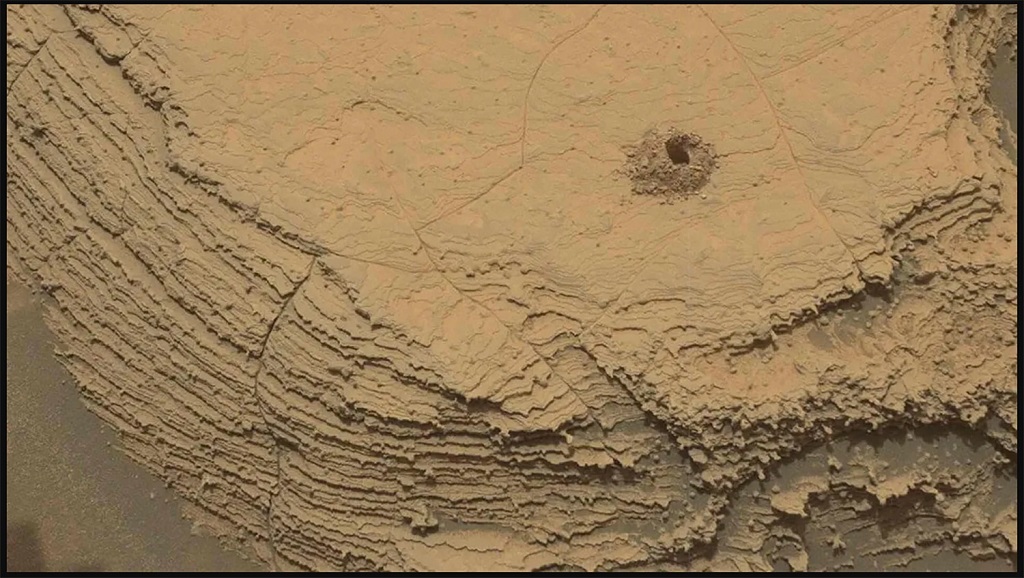 This photograph was taken by Curiosity using its Mast Camera, or Mastcam, near the site of its 36th productive drill hole on Mount Sharp, at a rock known as "Canaima."