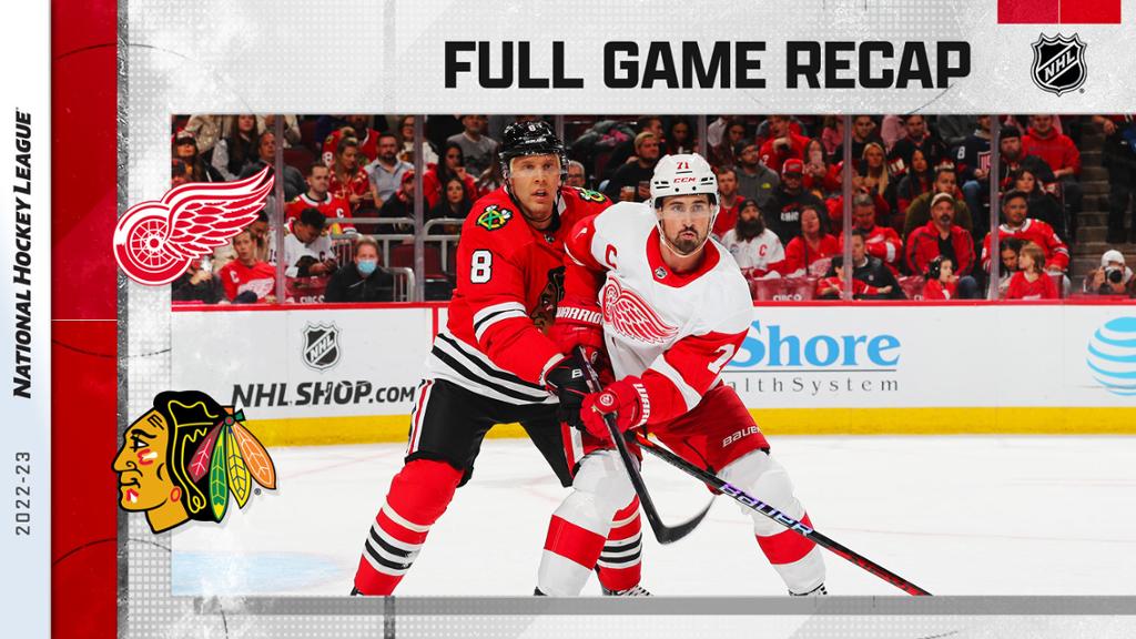 Domi, Blackhawks rally for overtime win over Red Wings in home opener