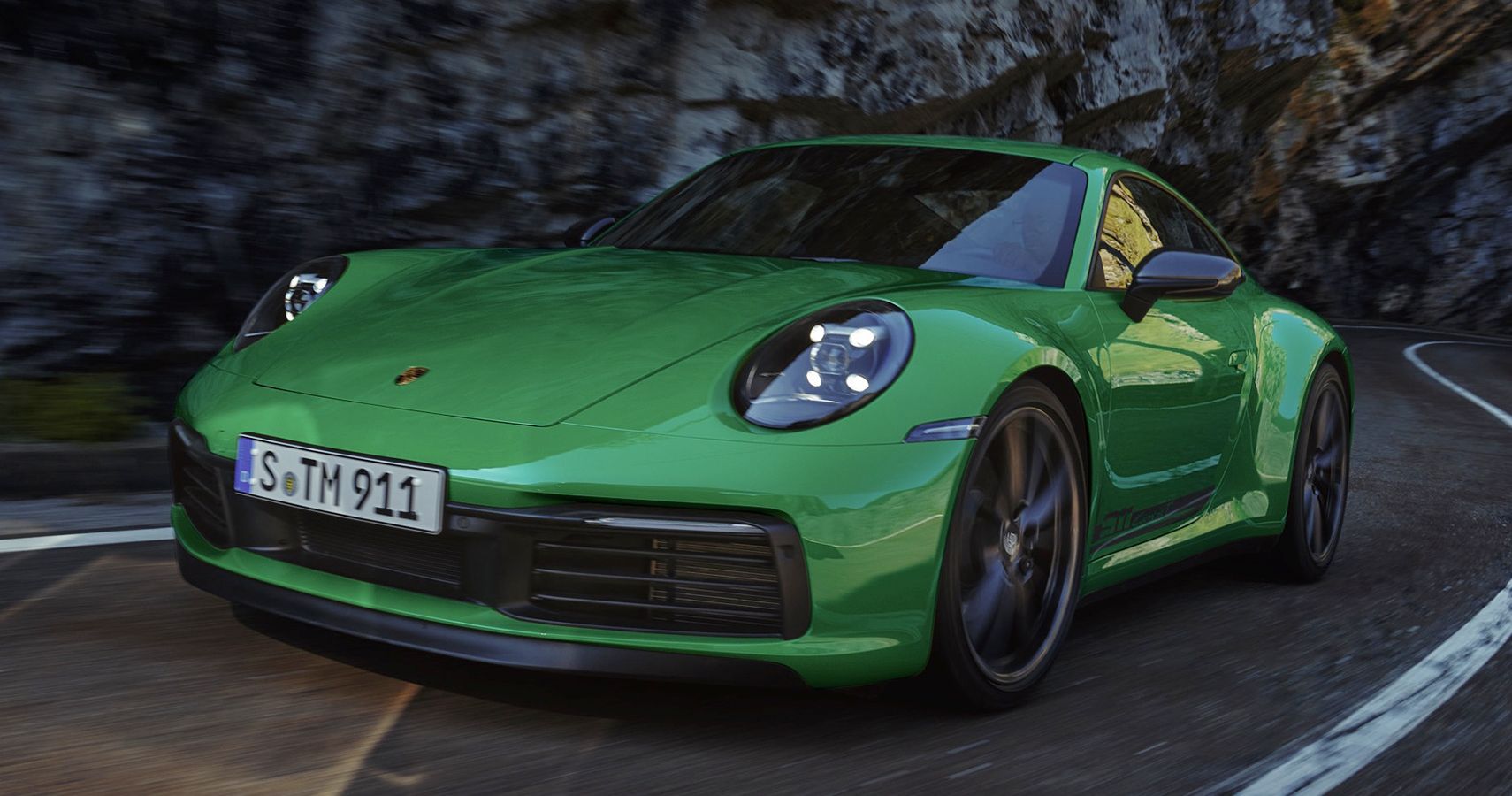 green Porsche 911 Carrera T road quarter front